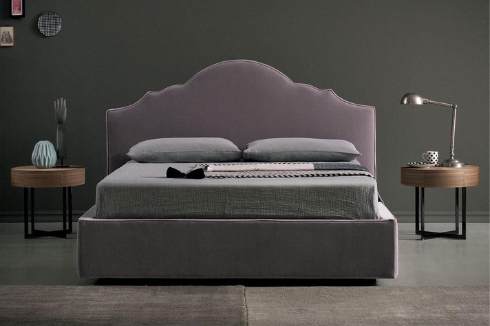 A romantic bed completed with two beautiful walnut bedside tables