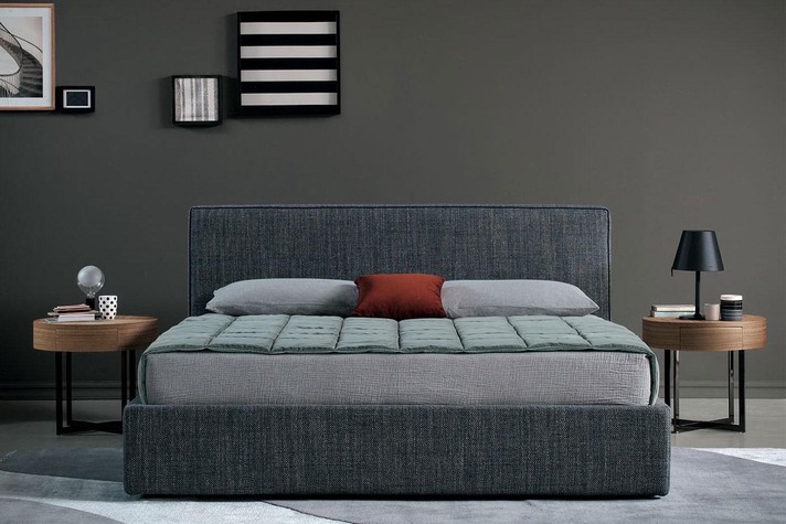 Cross legs and round top with drawer for a contemporary bedroom