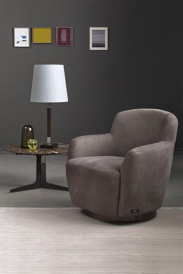 The round low table can be used as a side piece for a designer chair and lamp