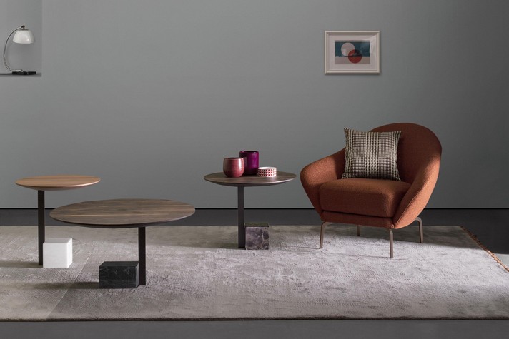 A set of 3 accent tables with wooden tops