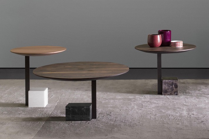 A set of 3 accent tables with wooden tops