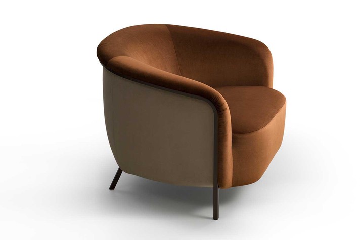 Metal frame and legs lighten the silhouette of the armchair