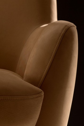 Detail of the stitching running along the contours of the armrests and seat