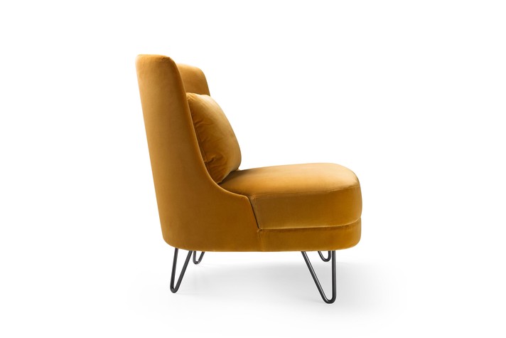 Lounge armchair with feather filled lumbar cushion