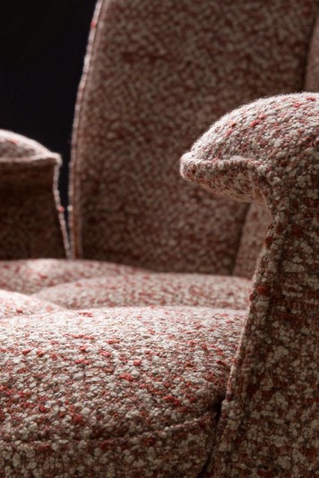 Details of the quilted seat and the armrests which curve inwards