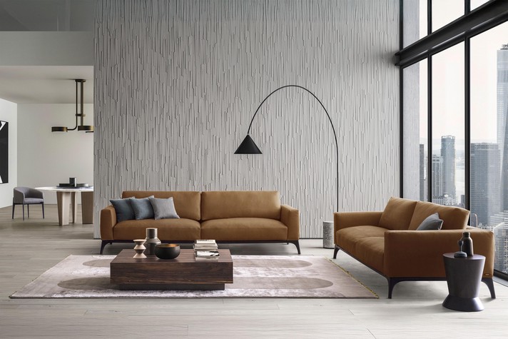 Fullprint rug in the centre of a living room with a double sofa Milano