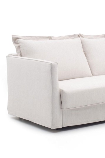 Detail of the slim arm and pillow-style ruffle edge cushions
