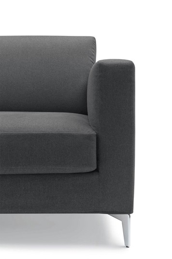 Detail of the squared track arm, tapered leg and box cushion