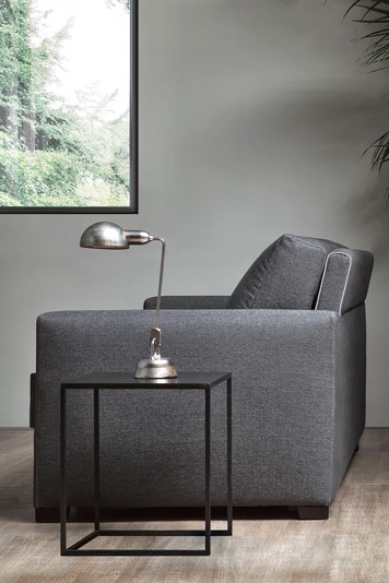 High backrest detailed with a contrast piping cord