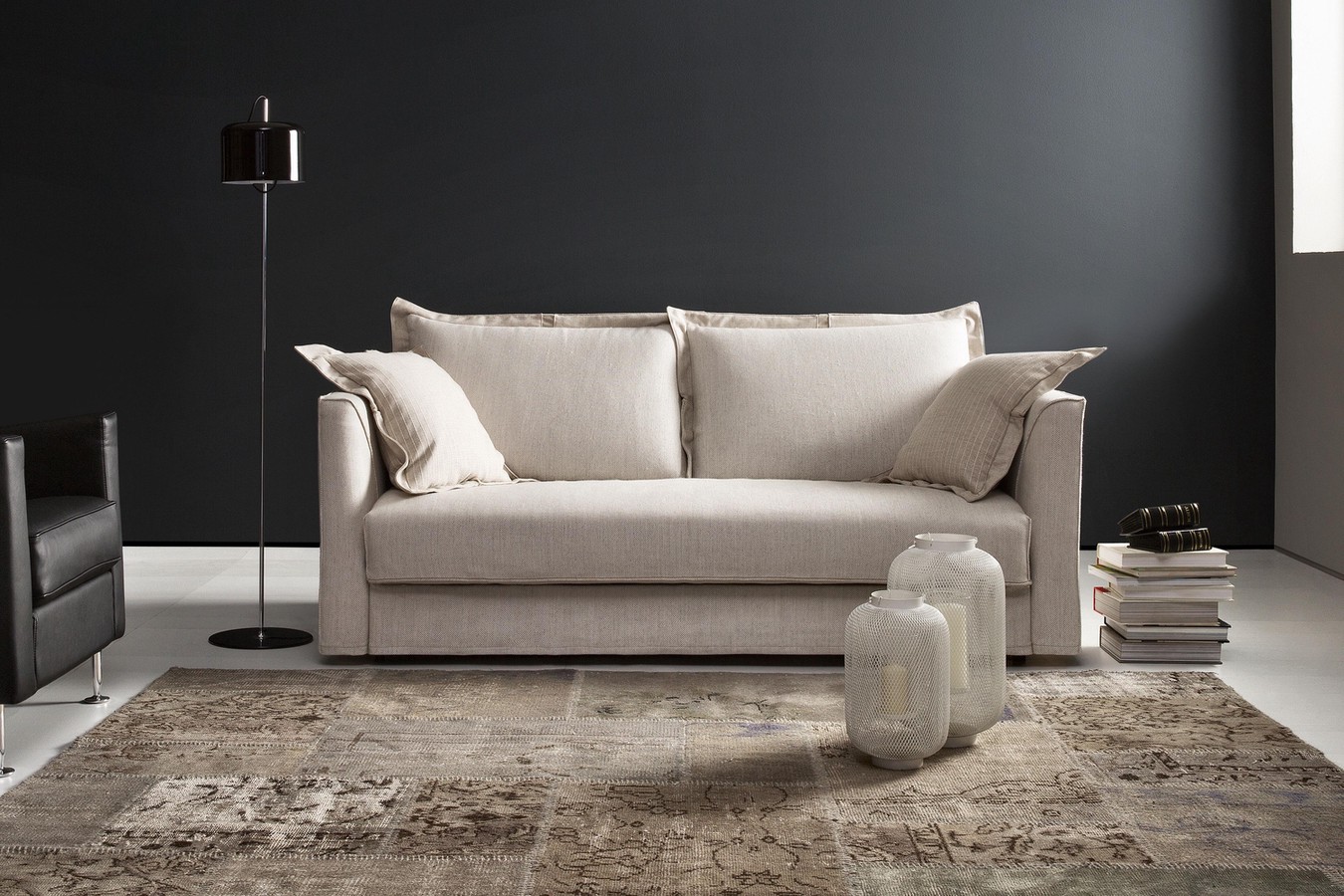 2-3 seater pillow back sofa bed, with loose ruffle-edge cushions and high slim arms
