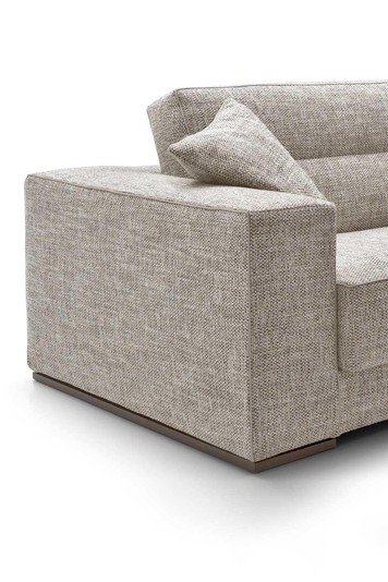 Detail of squared armrest with low plinth