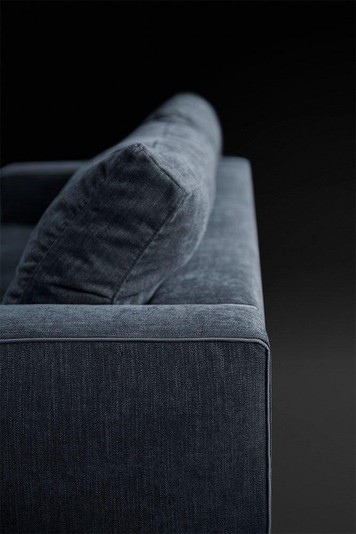 Detail of the backrest with its feather cushion