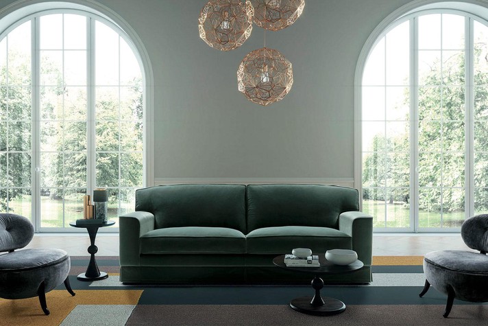 A retro vibe for a sitting room suite composed of velvet sofa and chairs