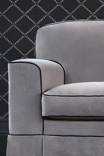 Detail of the rounded arm and box cushions with piping