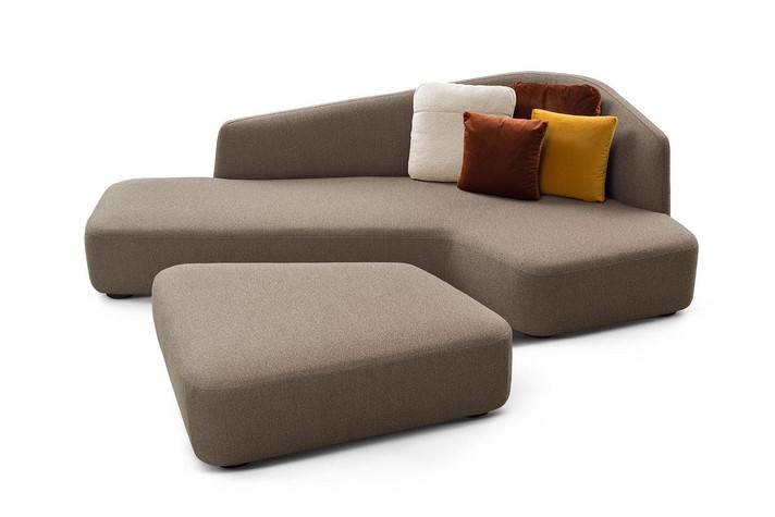 Small curved corner sofa with matching footstool