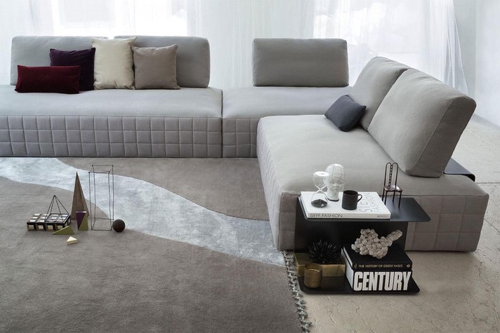Corner sofa with metal backrest and matching side table
