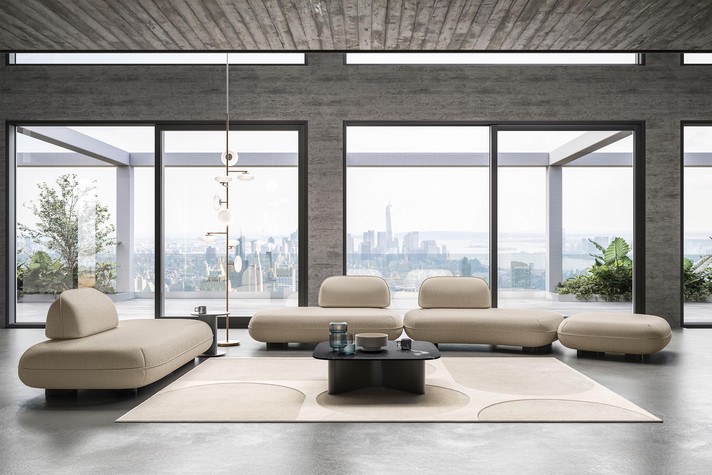 Modular linear sofa combined with a single module, used as a chaise-longue