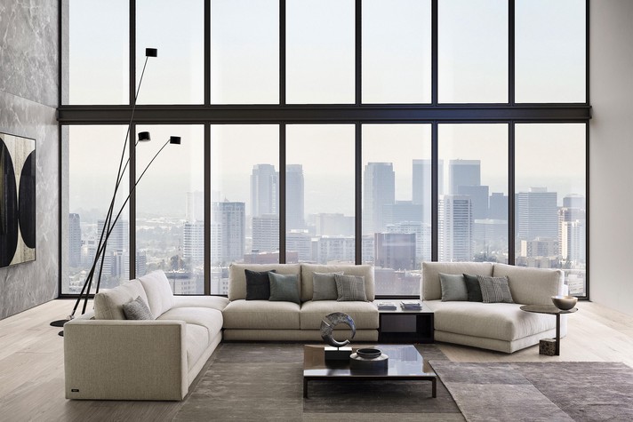 Large modular sofa with open corner, side table and an asymmetrical end module