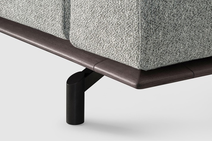 Detail of the Almond lacquered ash wood base on high feet