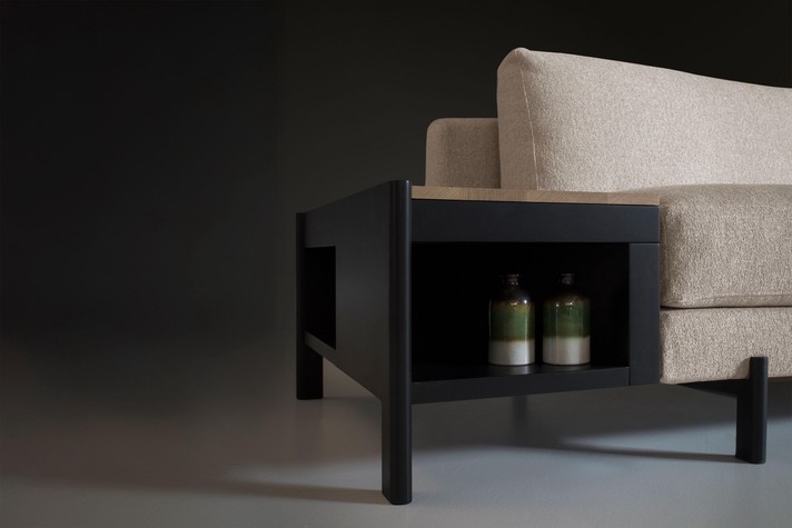 Details of the side table with a storage compartment, made from black lacquered wood
