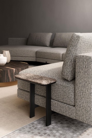 Detail of the coffee table next to a Mr President sofa