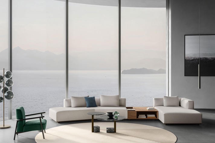 Original asymmetrical sofa with an open end without armrests, a storage side table and peninsula