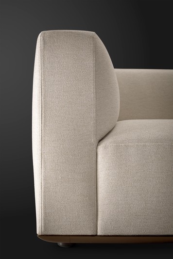 Details of the rounded armrest, delicately overlapping with the outer seat cushion
