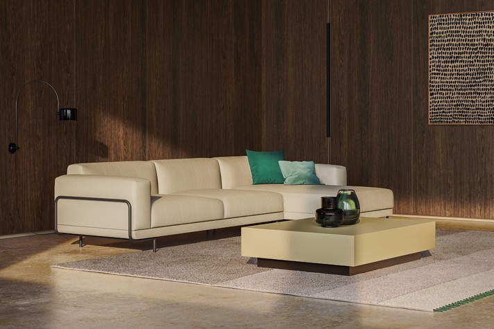 L-shaped sofa on high feet positioned in the centre of the room