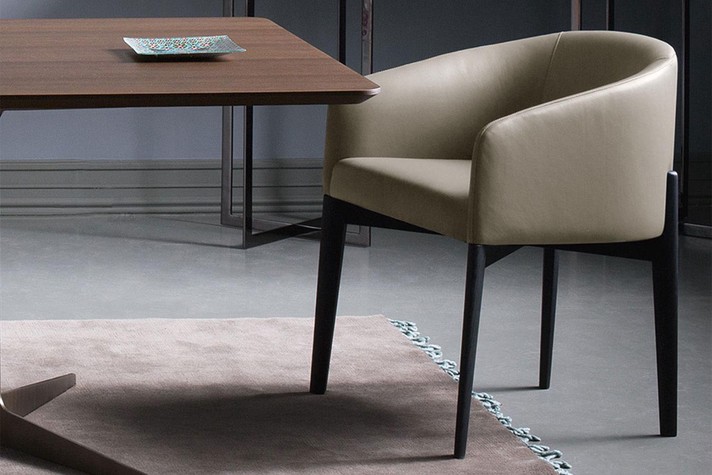 An elegant dining room armchair in beige leather