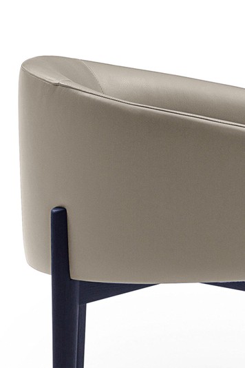 Detail of the seat set into the black lacquered solid wood structure