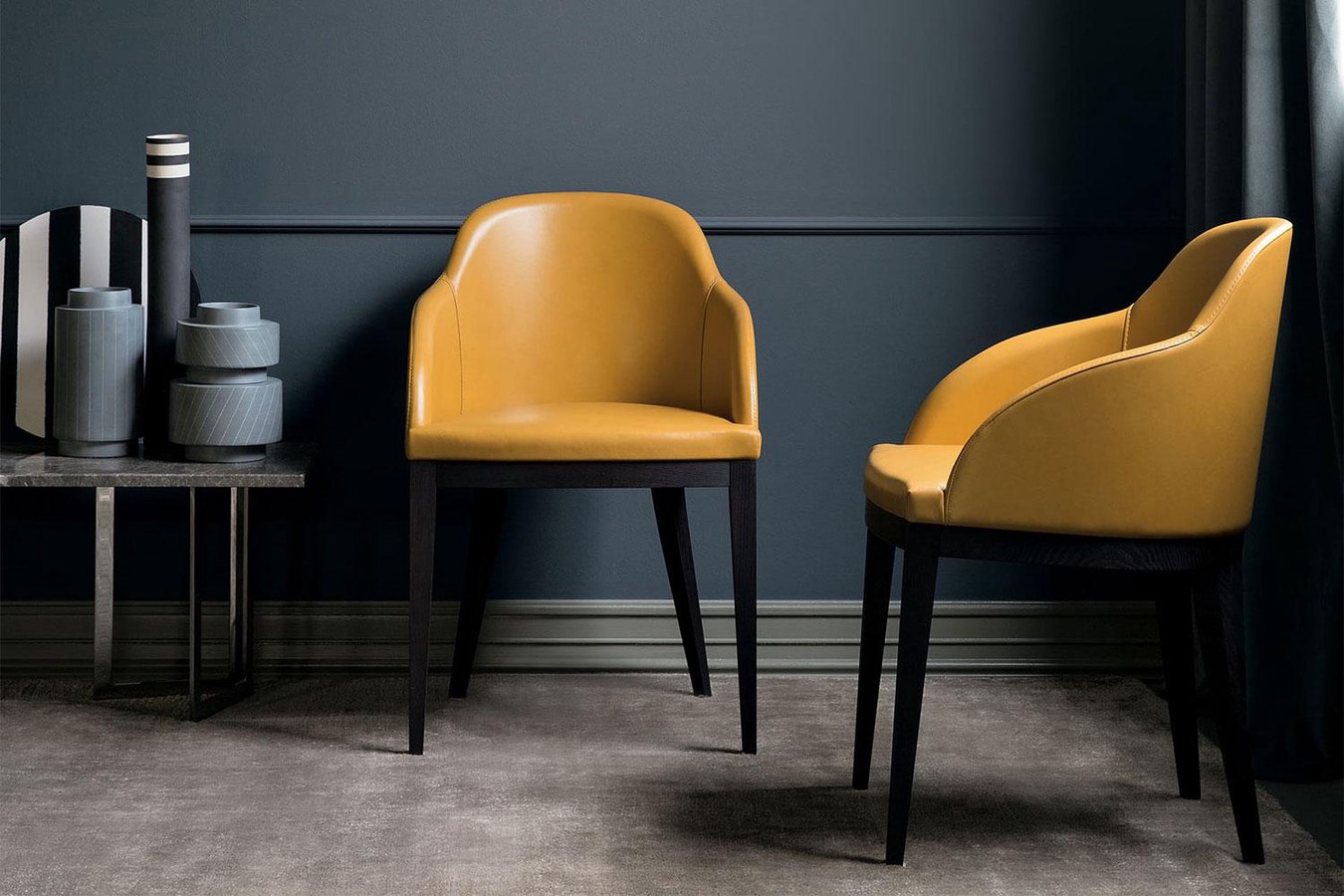 Curved back dining chair with wood legs and upholstered seat