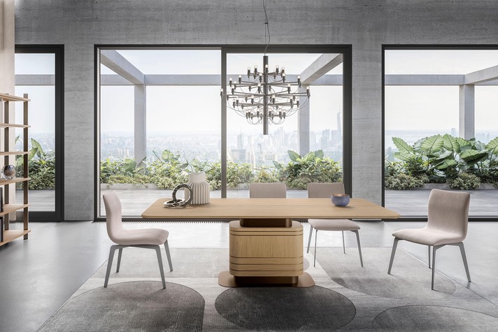 Pedestal dining table with a metal and inlaid wood base, enhancing seating ergonomics thanks to the exclusion of table legs