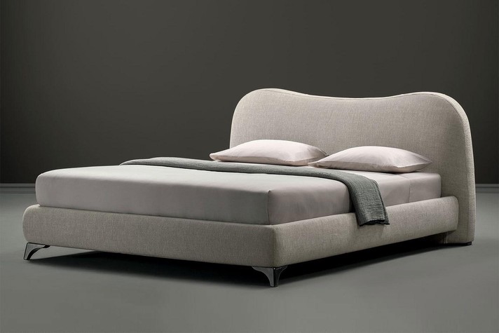 The upholstered bed is available in a wide range of fabrics, velvets and leathers