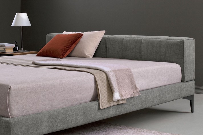 The vertical block pattern and slim frame make for a stylish bed with a contemporary allure