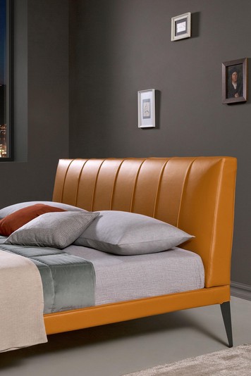 Slim frame, tall tapered legs and fluted headboard
