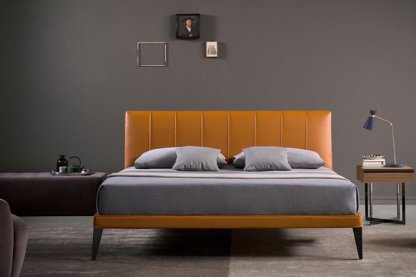 Contemporary king size upholstered platform bed with slatted base and high tapered legs