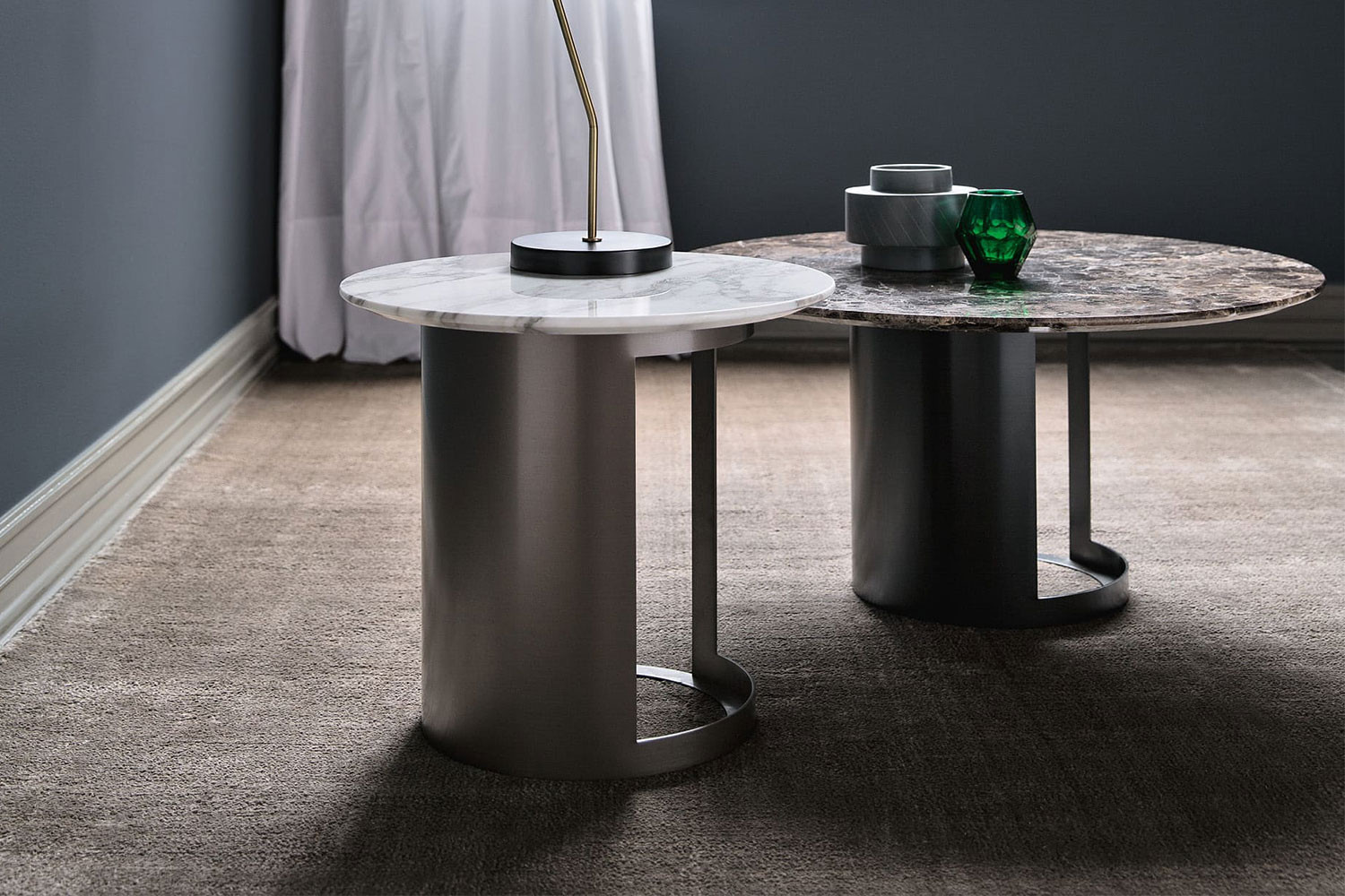 Marble side or coffee table with cut-out metal pedestal, in round, oval or barrel shapes
