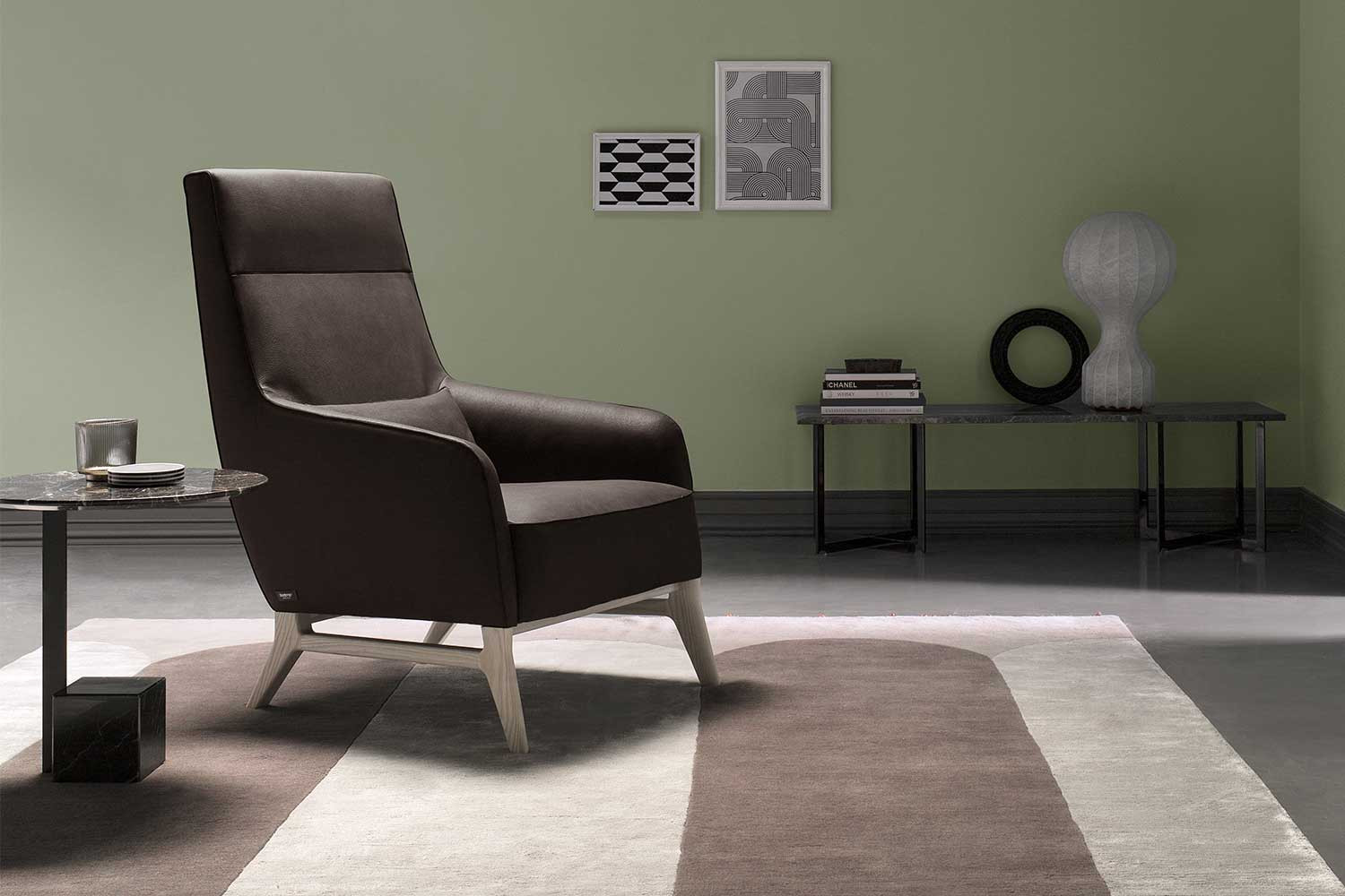 Mid-century inspired designer armchair with ash wood legs and a high or low back