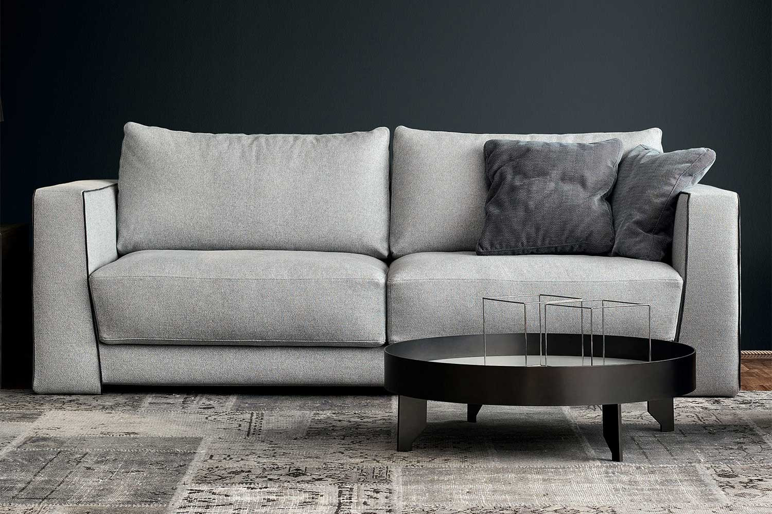 A modern high arm sectional sofa with loose box cushion sectional sofa with feather filled box cushions