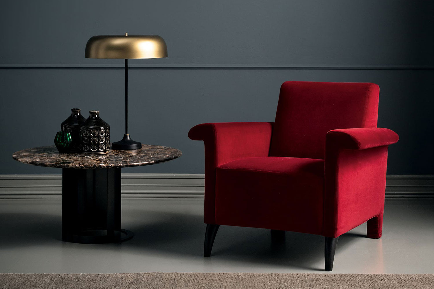 Single seat transitional armchair with winged arms and tapered legs