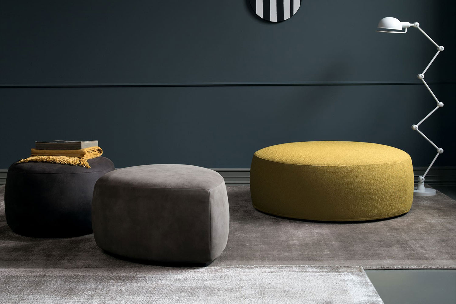 Contemporary, minimalist upholstered pouffes with a low wooden plinth base