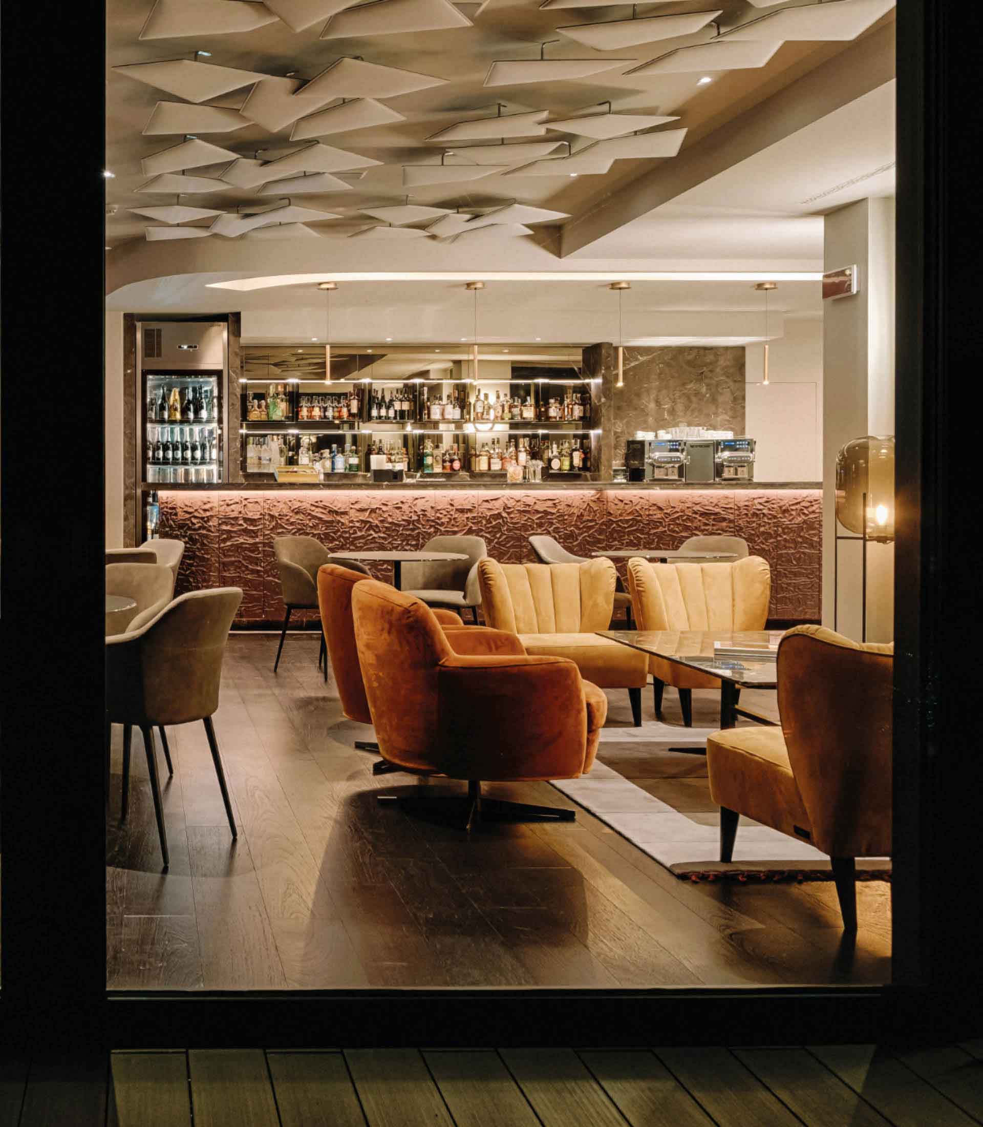 Hotel dining room and lounge with upholstered armchairs