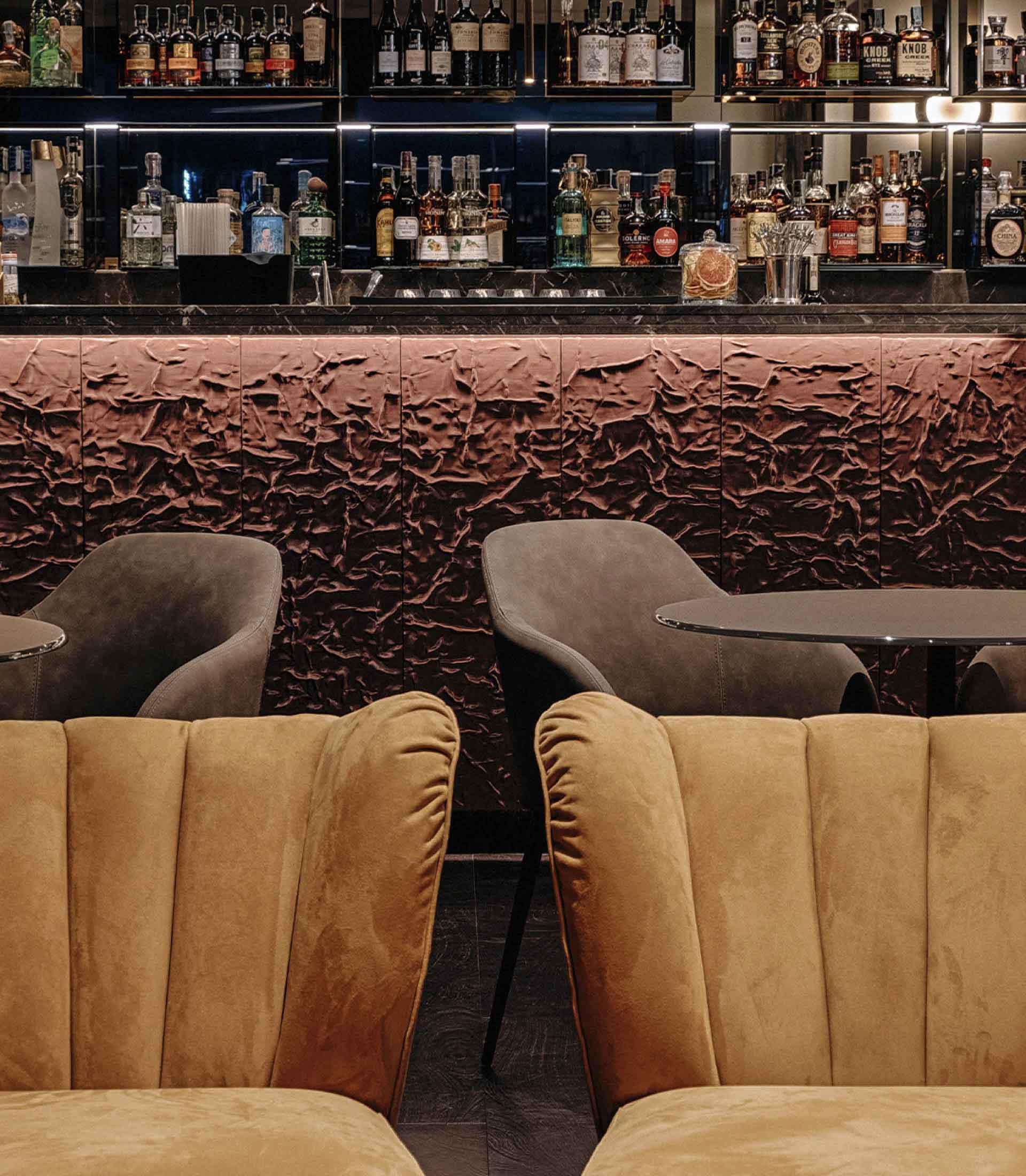 Detail of the hotel bar area with armchairs