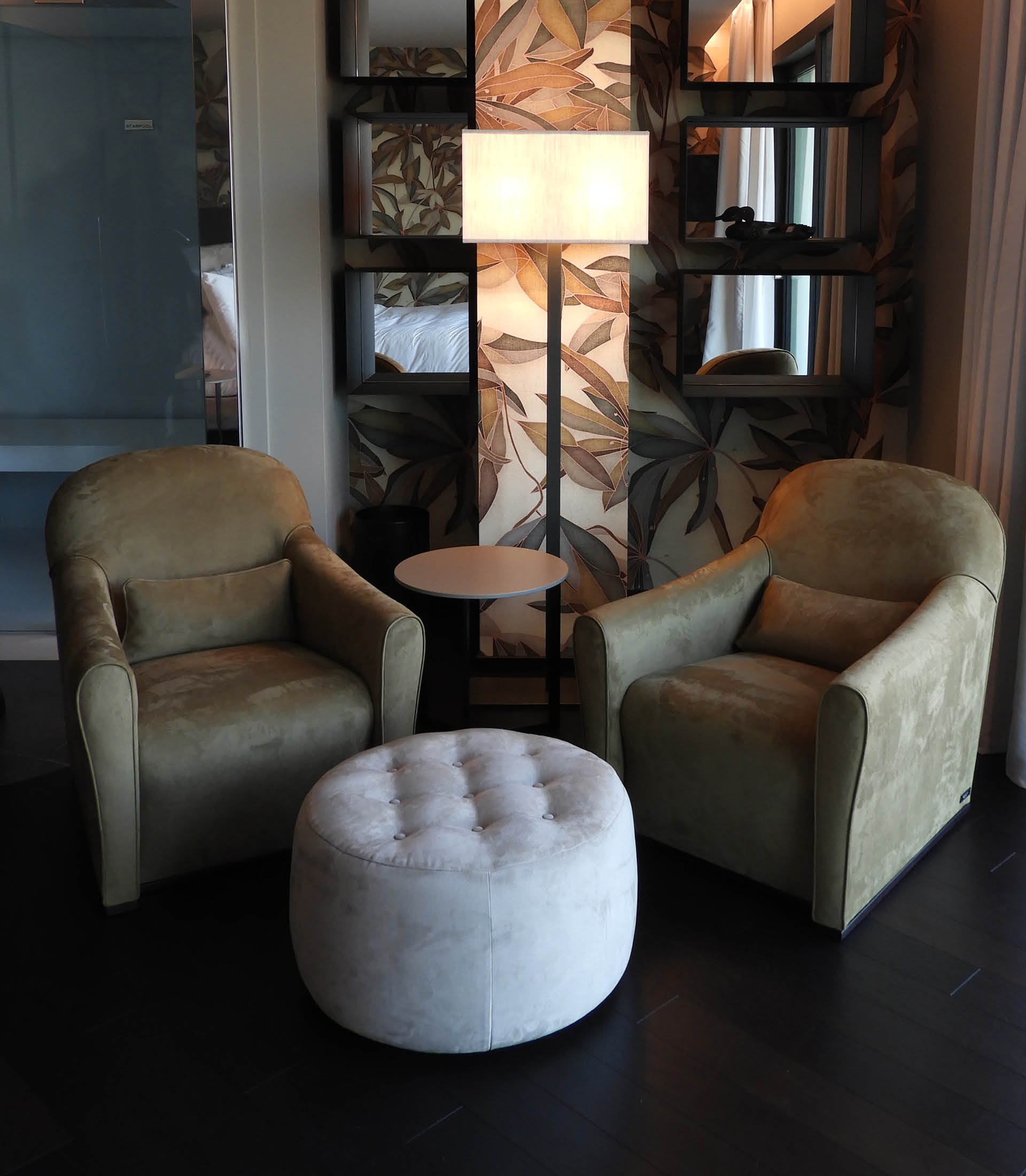 Hotel conversation area with poufs and armchairs from the Bodema collection