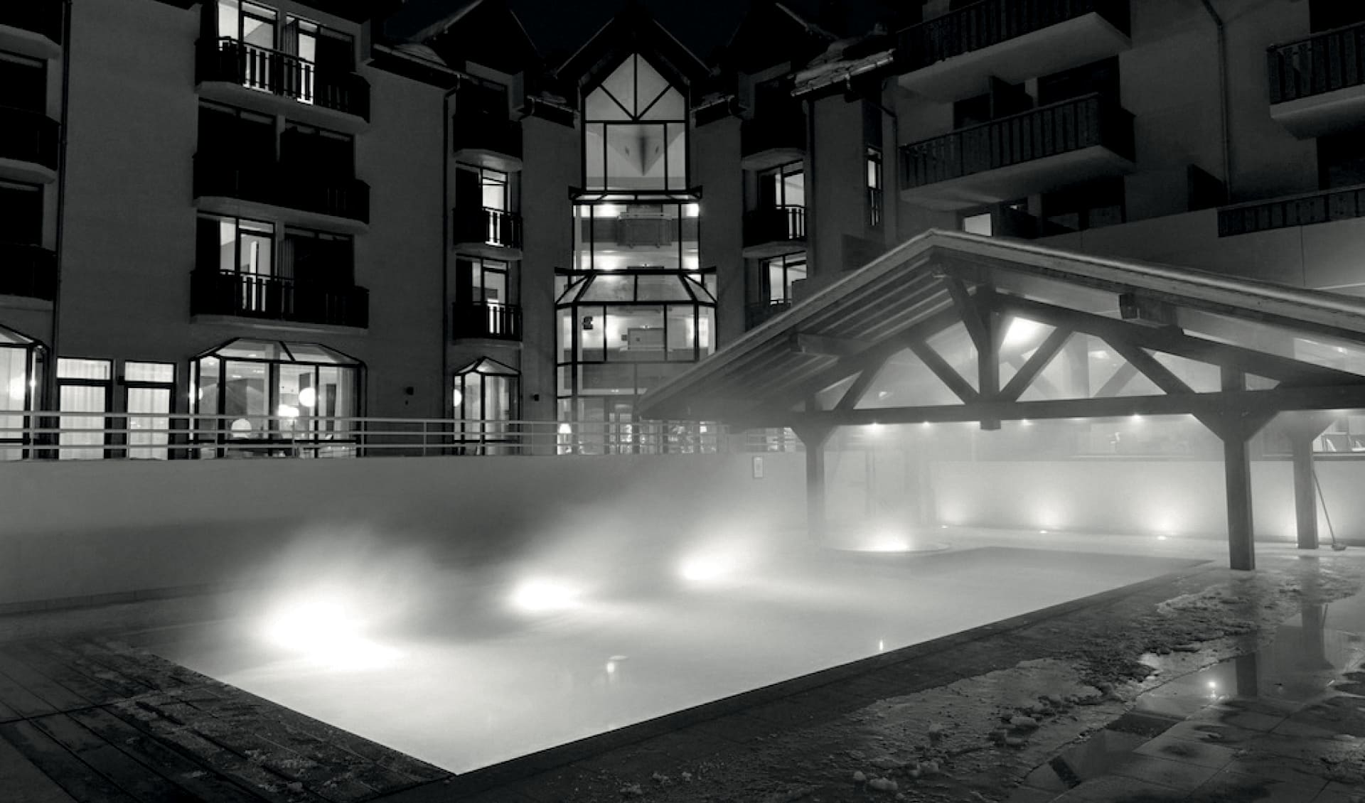 Outdoor swimming pool at Hotel Le Refuge des Aiglon