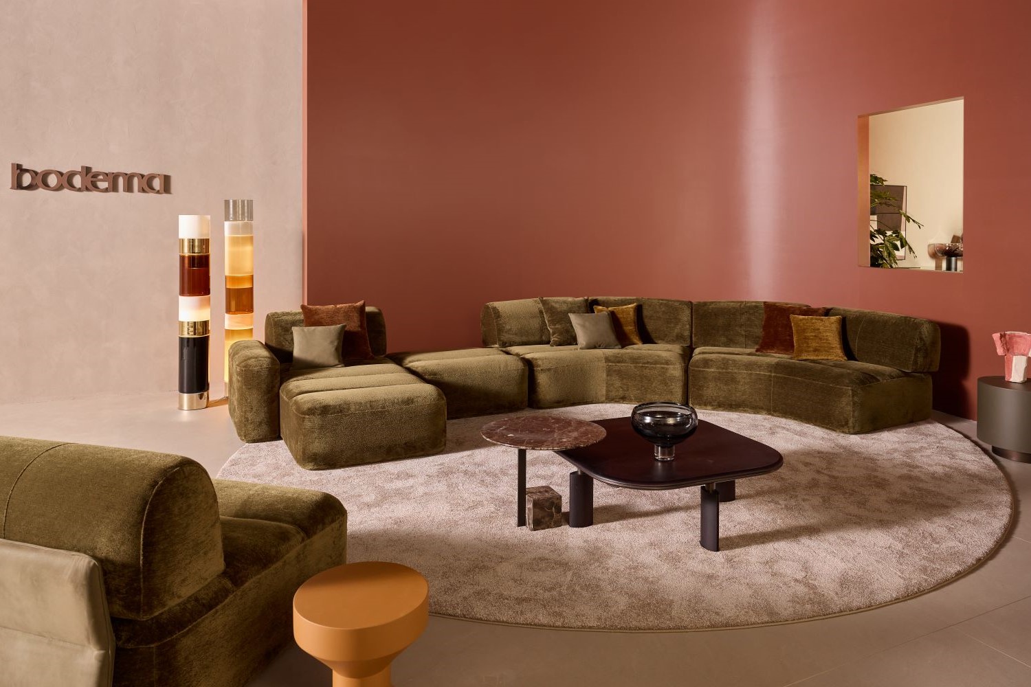Interior of the Bodema stand at Salone del Mobile 2026, living area with sofa and coffee tables